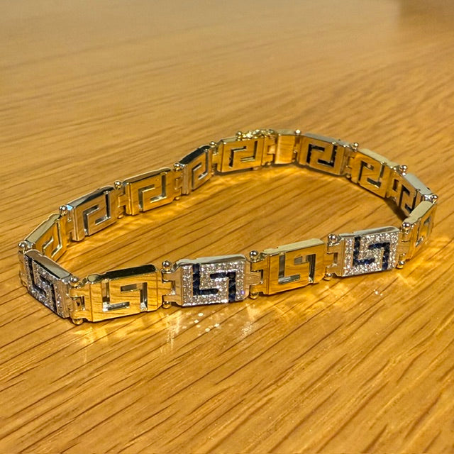 18CT YELLOW AND WHITE GOLD DIAMOND AND SAPPHIRE GREEK KEY BRACELET