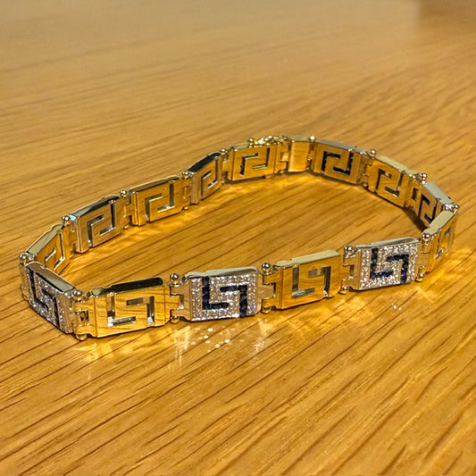 18CT YELLOW AND WHITE GOLD DIAMOND AND SAPPHIRE GREEK KEY BRACELET
